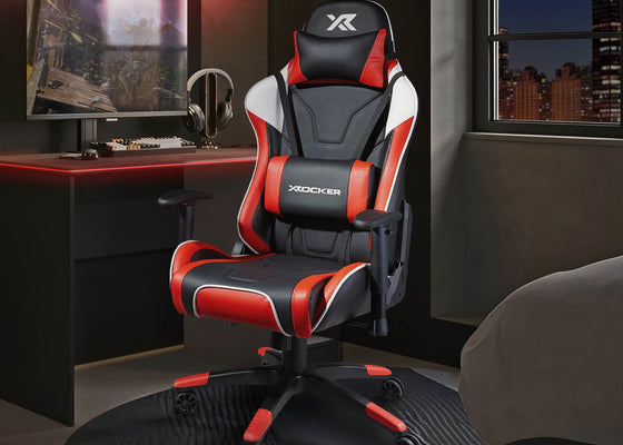 Agility Gaming chair with red accents in a room setup with a desk and monitor.