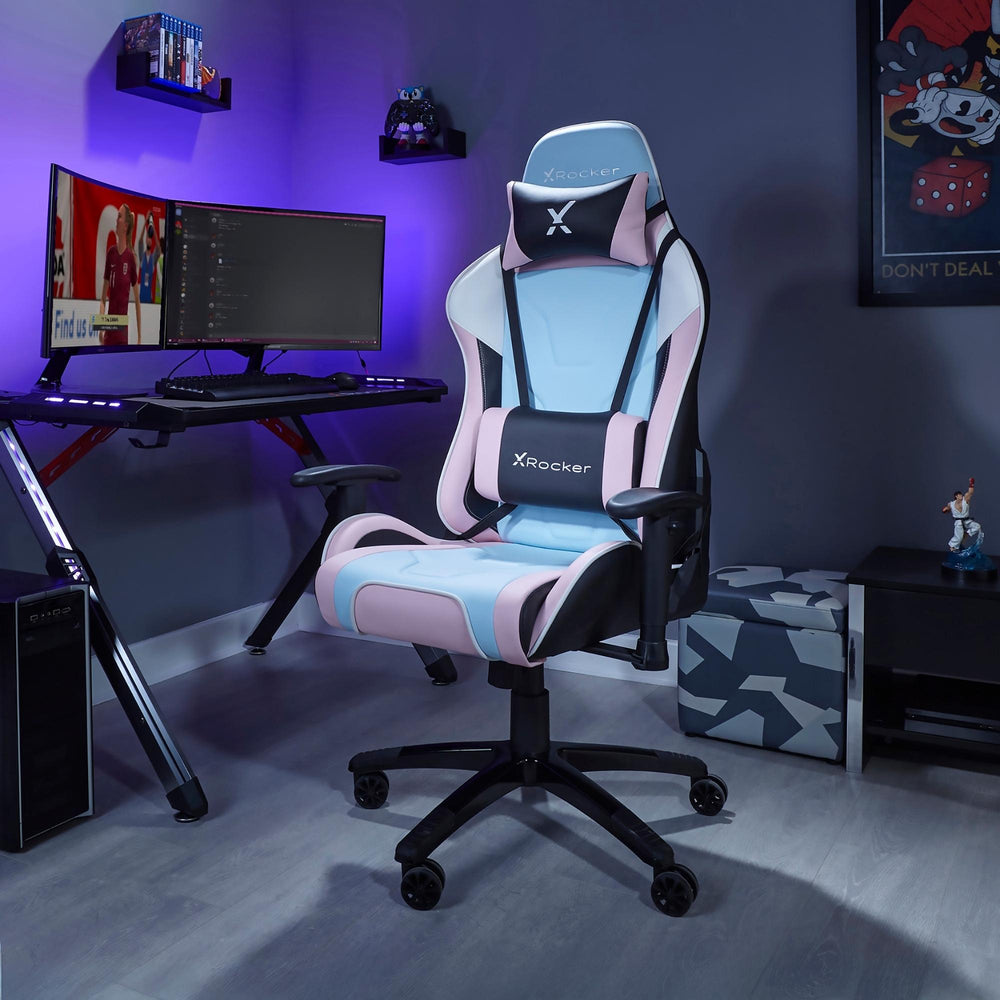 Gaming chair with X rocker logo in a room setup with a desk and computer monitors.