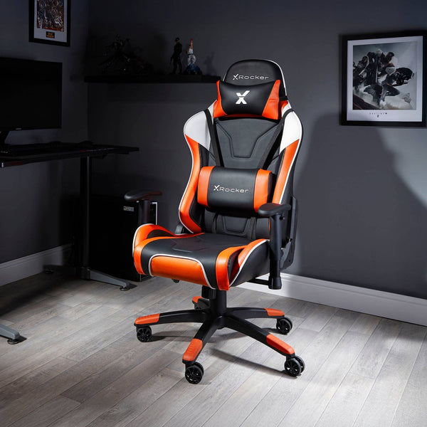 Black and orange gaming chair with X rocker logo in a room setting.
