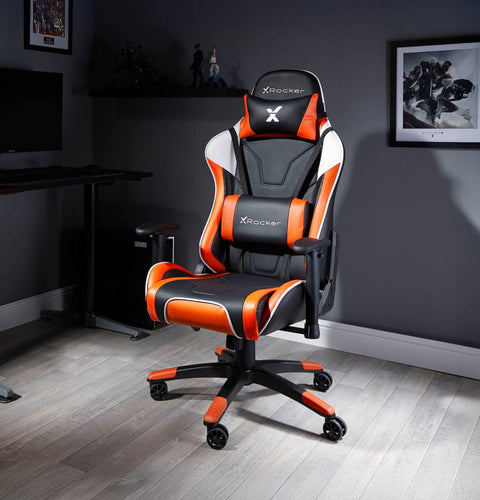 Black and orange gaming chair with X rocker logo in a room setting.
