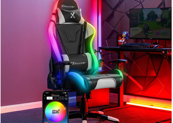 Gaming chair with RGB lighting in a room setup with a computer desk and colorful walls.