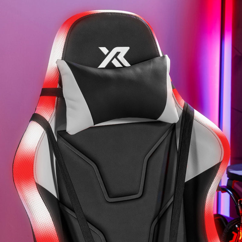 Gaming chair with headrest and neck pillow on a colorful background