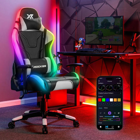 Gaming chair with RGB lighting in a room setup with a computer desk and smartphone app.