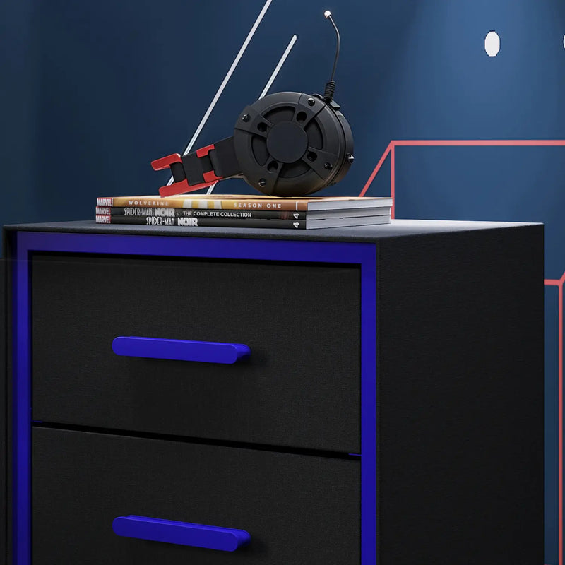 Black dresser with blue accents featuring a vintage-style radio and books on a dark blue background.