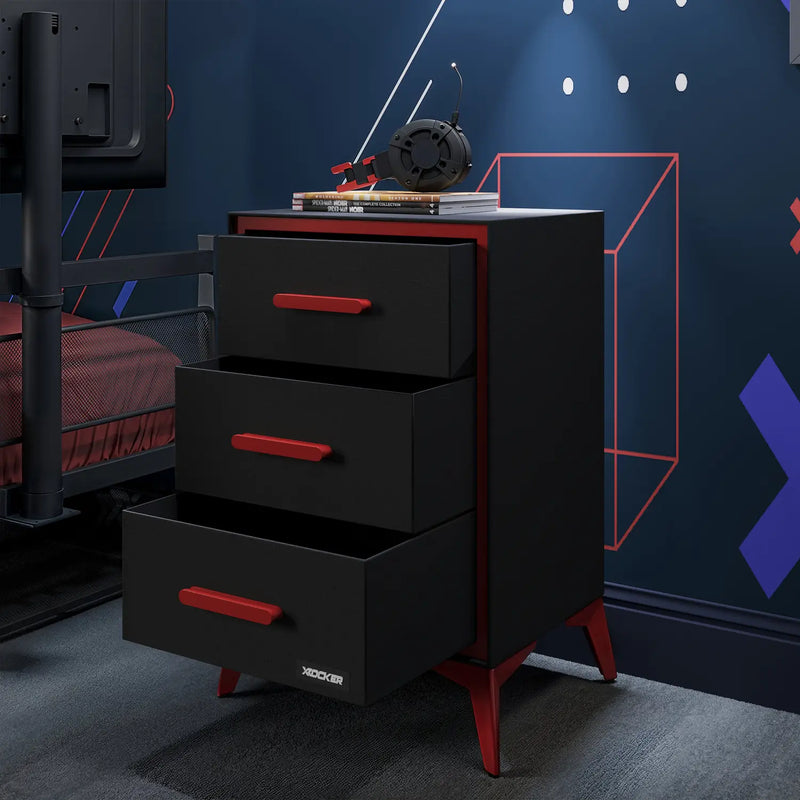 Black dresser with red accents in a room with blue walls and geometric wall art.