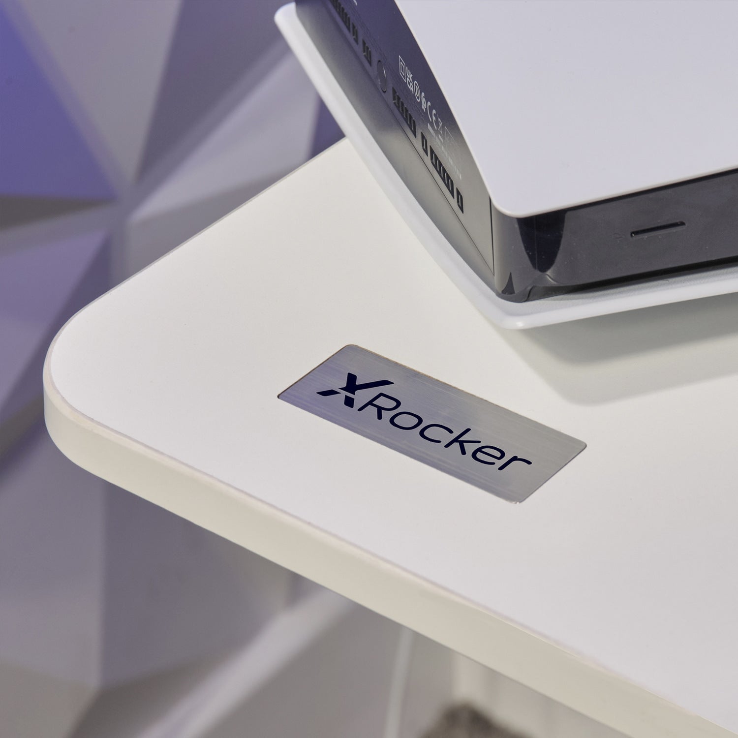 Streamlined white adjustable desk with monitor and laptop