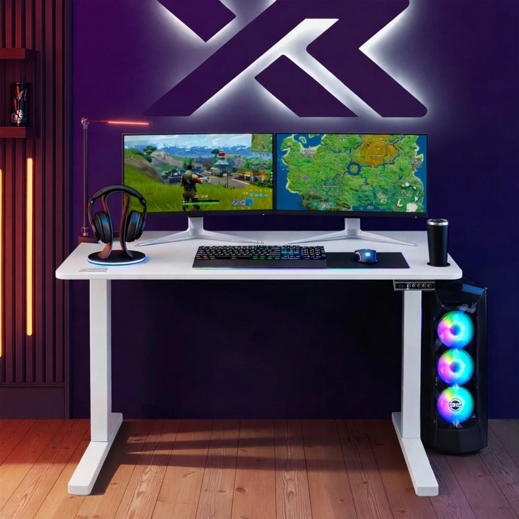 Gaming setup with dual monitors, keyboard, mouse, and RGB LED computer case on a height adjustable white desk.