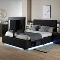 Modern bedroom with a black upholstered bed and LED lighting