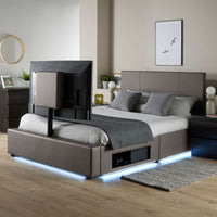 Modern bed with TV above in a bedroom setting