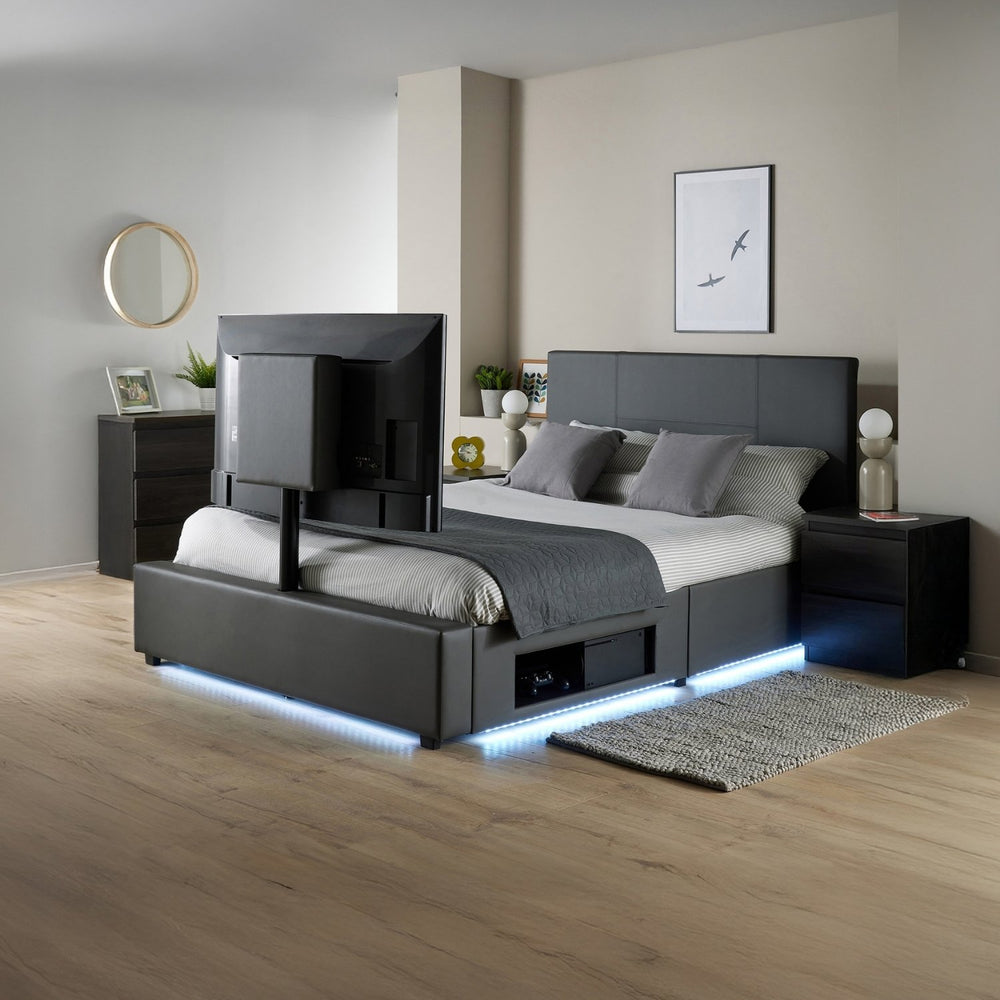Modern bedroom with a black bed, nightstands, and decorative items.