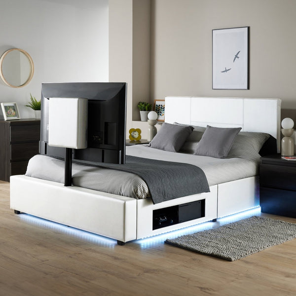 Modern bedroom with a bed featuring a built-in TV and LED lighting.