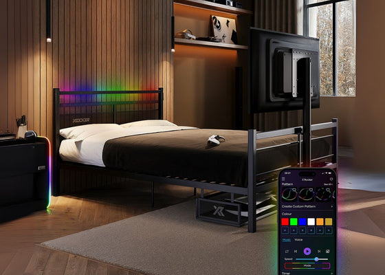 Bedroom with a bed and smartphone displaying RGB color options.