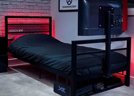 Bedroom with a basecamp tv gaming bed and TV setup, featuring X rocker branding.