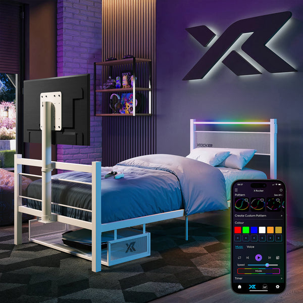 Modern bedroom with a bed, TV, and smartphone displaying RGB lighting control app.