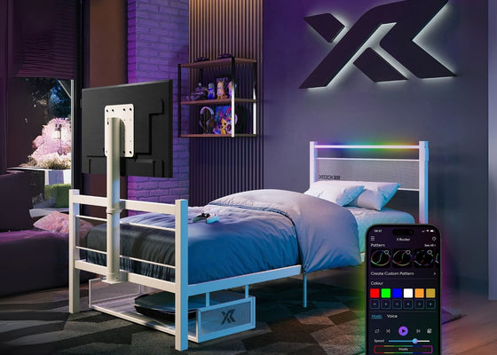 Modern bedroom with a bed and smart TV, featuring a smartphone app for control.
