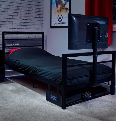 Bedroom setup with a bed, TV stand, and gaming-themed decor.