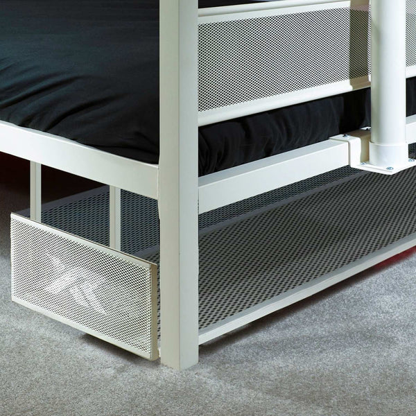 Metal bed with mesh design on a gray carpeted floor
