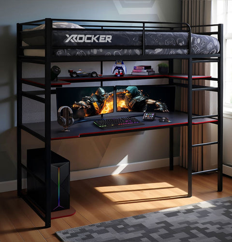 Black X rocker gaming desk with two monitors, keyboard, and mouse in a room.