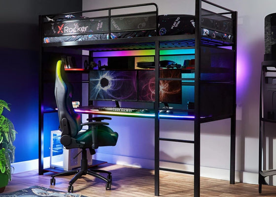 Gaming room setup with a high chair, desk, and computer setup.