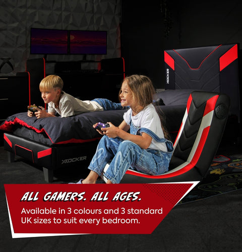 Two children playing video games on a gaming bed with promotional text overlay.