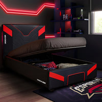 Black and red bed with storage compartment in a room with neon lights and a window.