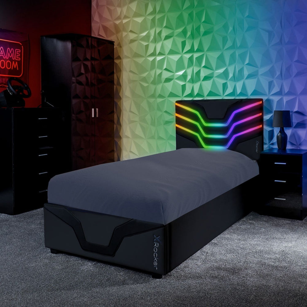 Modern bedroom with a bed, nightstands, and colorful wall design.