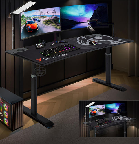 Gaming desk with multiple monitors and gaming accessories in a dimly lit room.