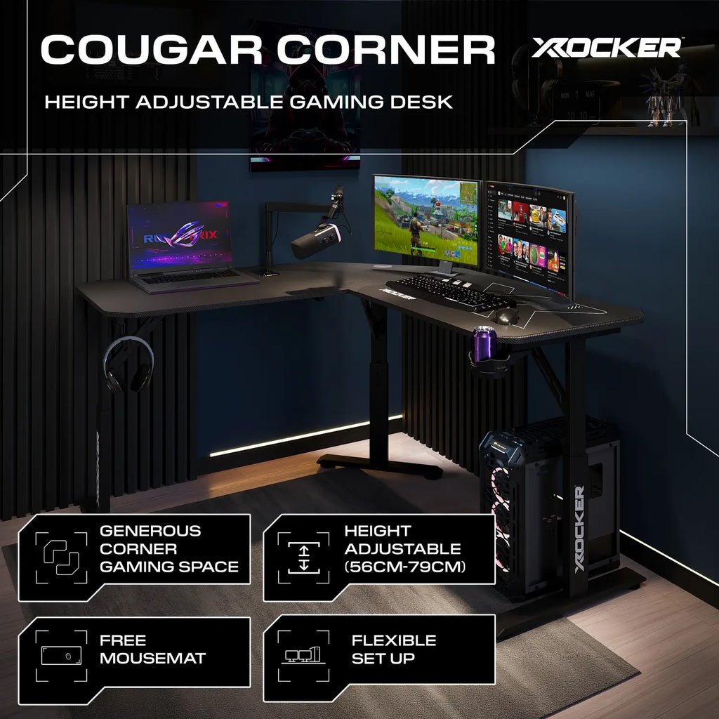 Height adjustable corner gaming desk with multiple monitors and gaming equipment, featuring Cougar and X rocker branding.