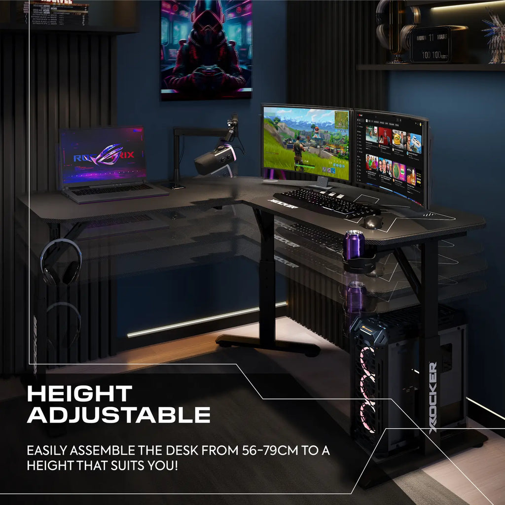 Gaming setup with height-adjustable desk, multiple monitors, and gaming equipment.