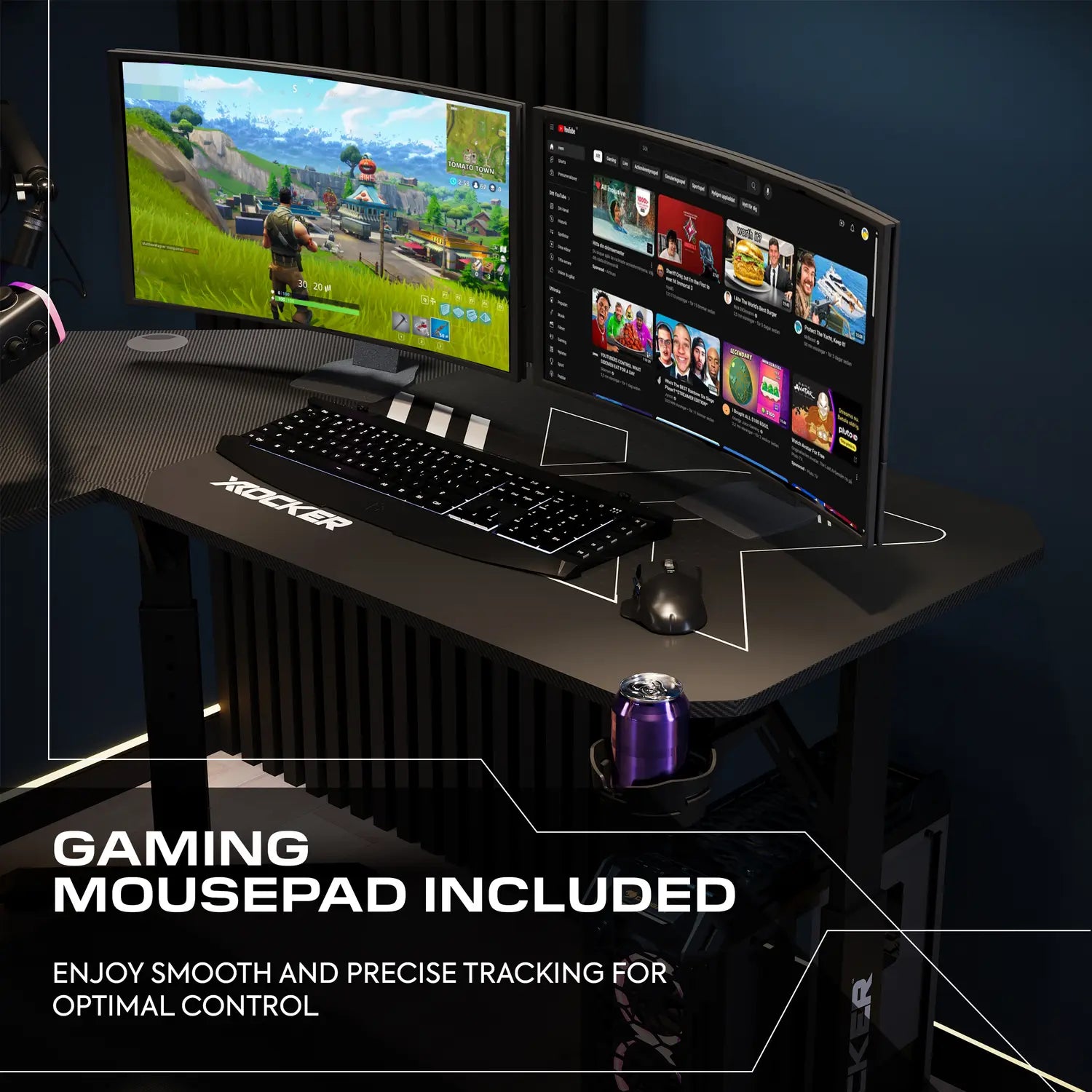 Gaming setup with dual monitors, keyboard, and mouse on a desk with a mousepad.