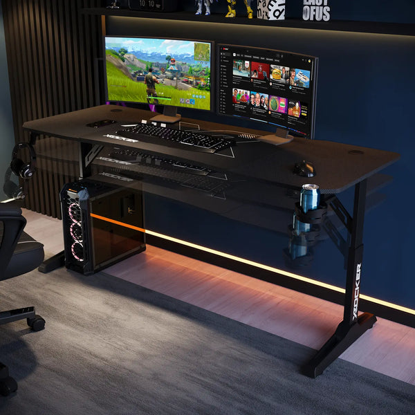 Gaming setup with a desk, monitors, keyboard, and chair in a room.