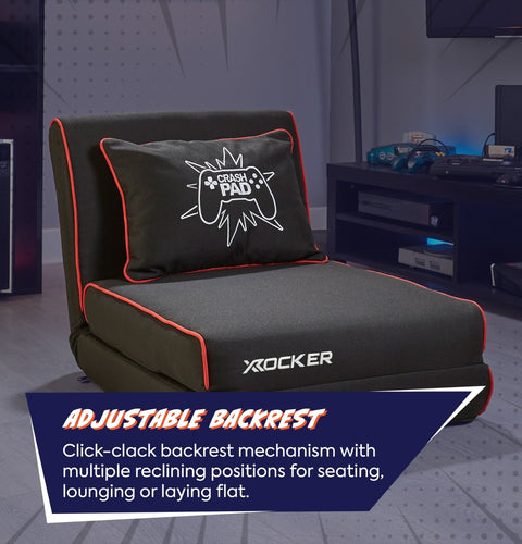 Gray gaming chair with adjustable backrest and X rocker branding in a room setting.