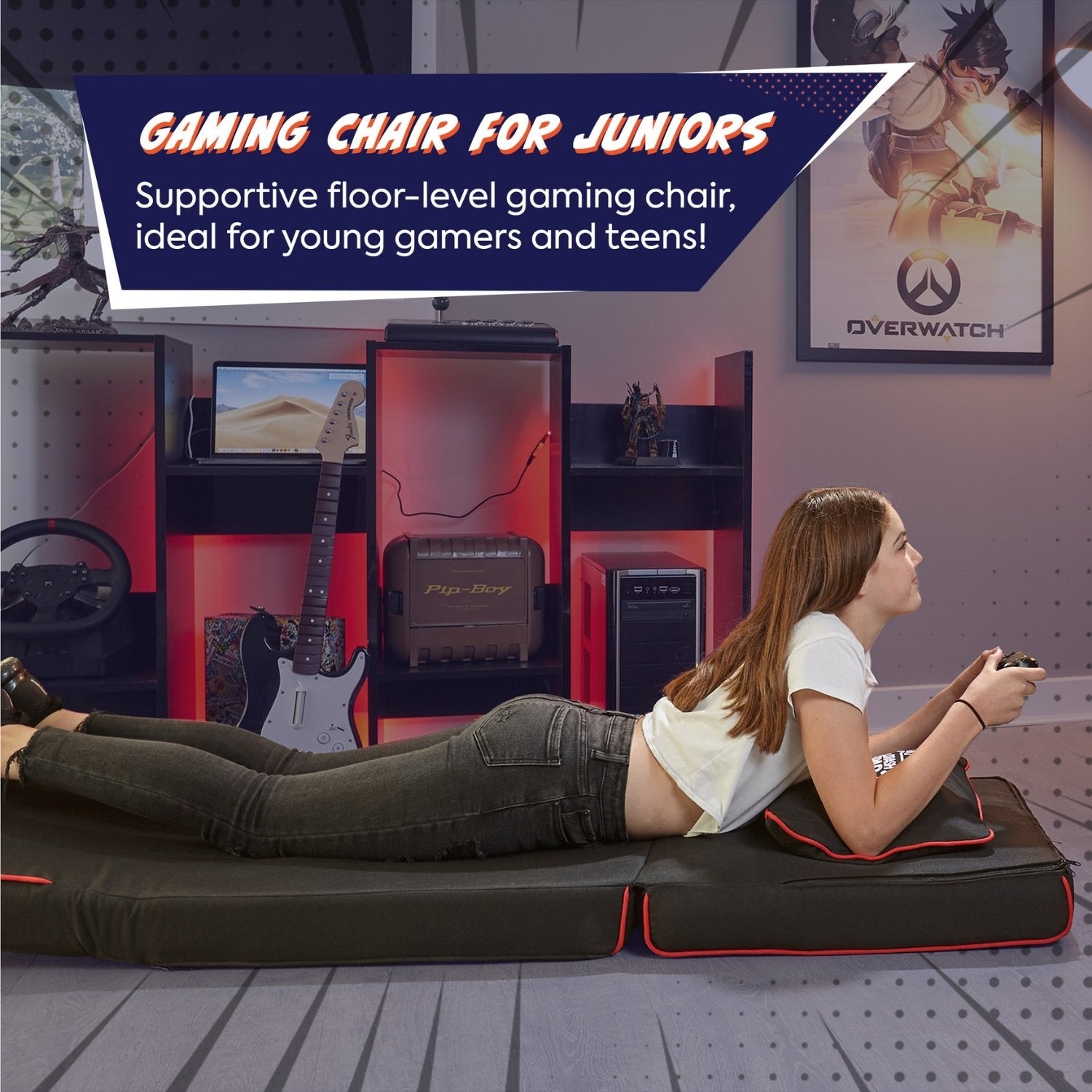 Gaming chair for juniors with a person lying on it in a room with gaming equipment.