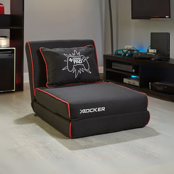 Black Z Frame Futon / gaming chair with pillow in a room setting