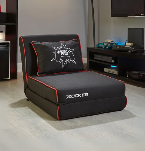 Black Z Frame Futon / gaming chair with pillow in a room setting