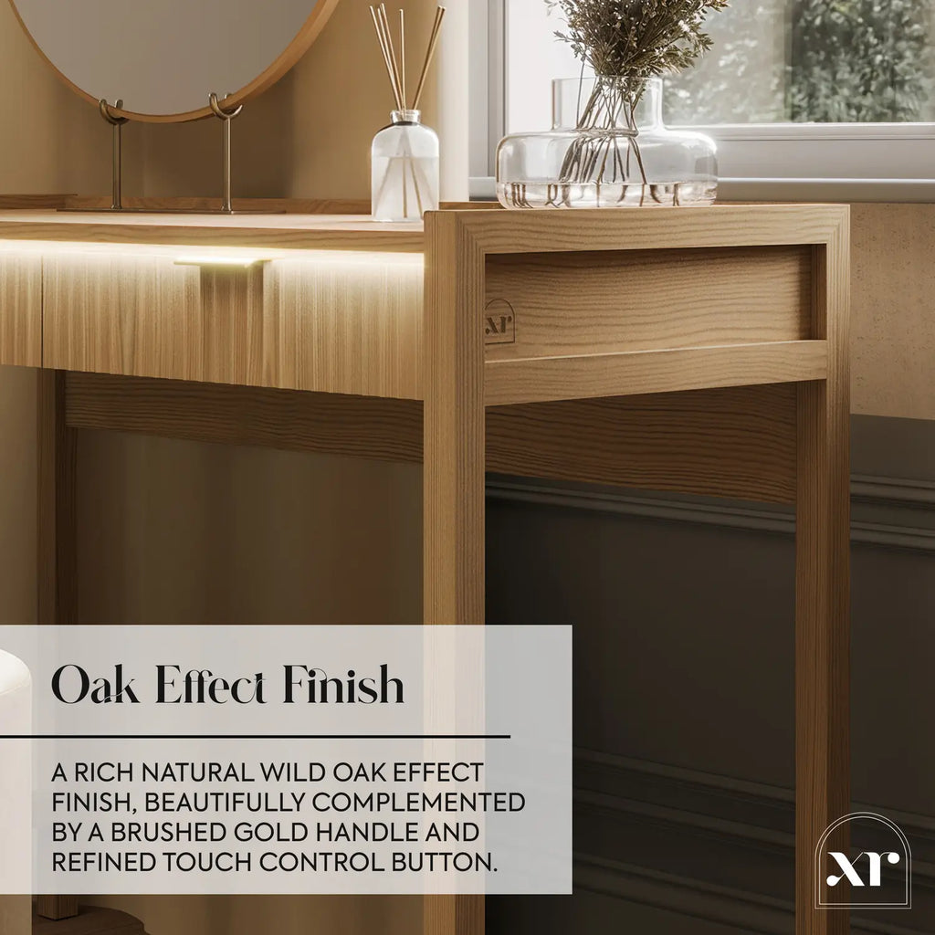 Wooden desk with a mirror, diffuser, and vase in a room with a window.