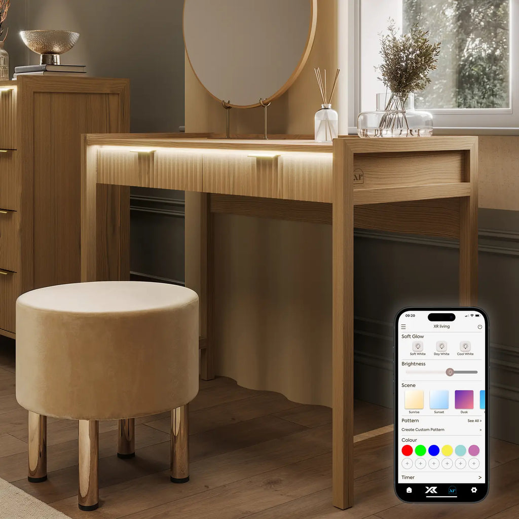 Dakota Wooden vanity table with mirror, stool, and smartphone displaying color selection app in a room.