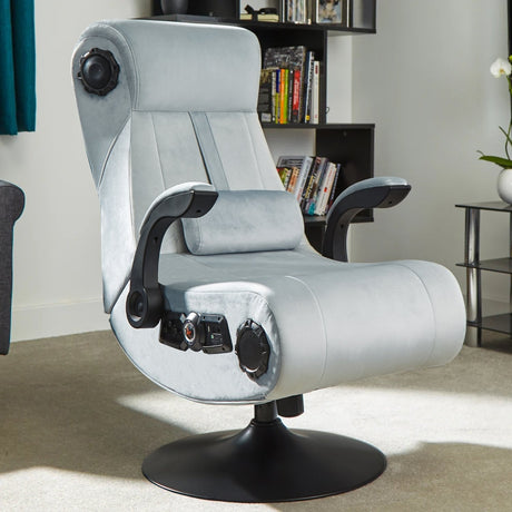 Gray gaming chair with control panels in a room setting