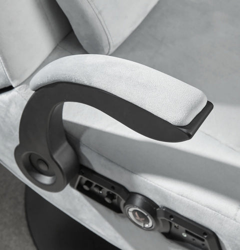 Close-up of the gaming chairs armrest handle and lock mechanism.