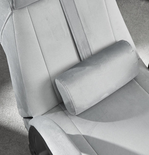 Gray office chair with a headrest in a minimalistic setting