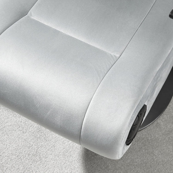 Close-up of a gray recliner chair with a focus on the armrest and seat.