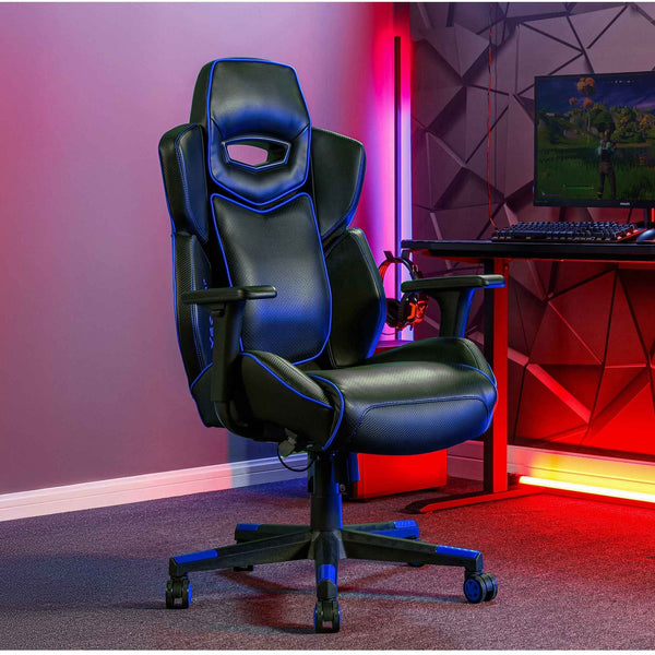 Gaming chair in a room with red and purple lighting, featuring a computer setup.