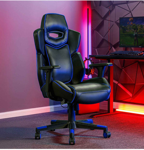 Gaming chair in a room with red and purple lighting, featuring a computer setup.