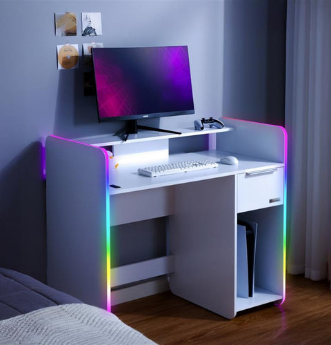 Modern white desk with computer setup in a room with RGB lighting