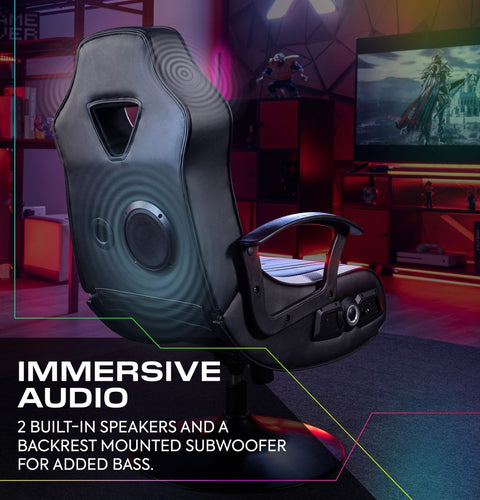 Gaming chair with immersive audio features in a room setup with a TV and gaming accessories.
