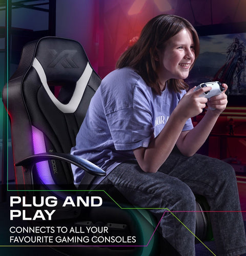 teen playing video games on a gaming chair with text 'Plug and Play' and console compatibility.