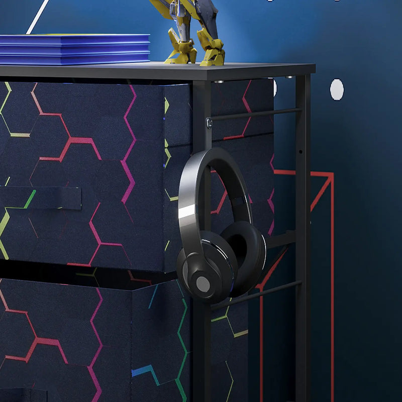 Black canvas drawers with geometric design, headphones, and a robot model against a blue wall.