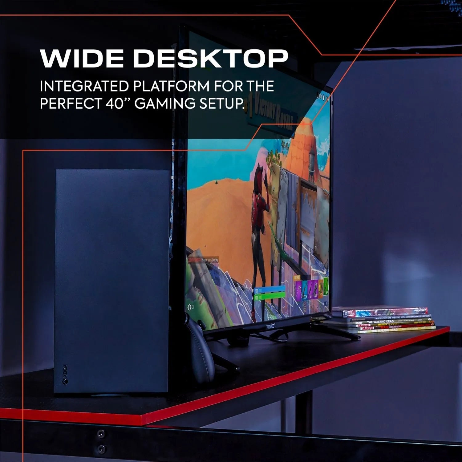 Gaming setup with a wide desktop and monitor displaying a colorful game.