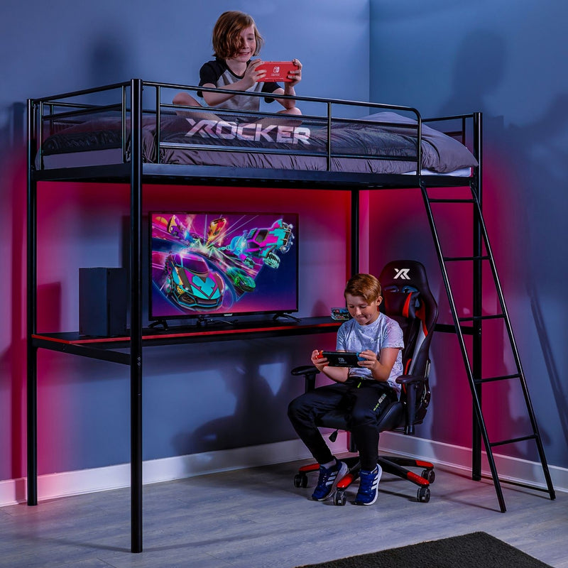 Children playing video games in a room with a gaming desk and X rocker branded furniture.