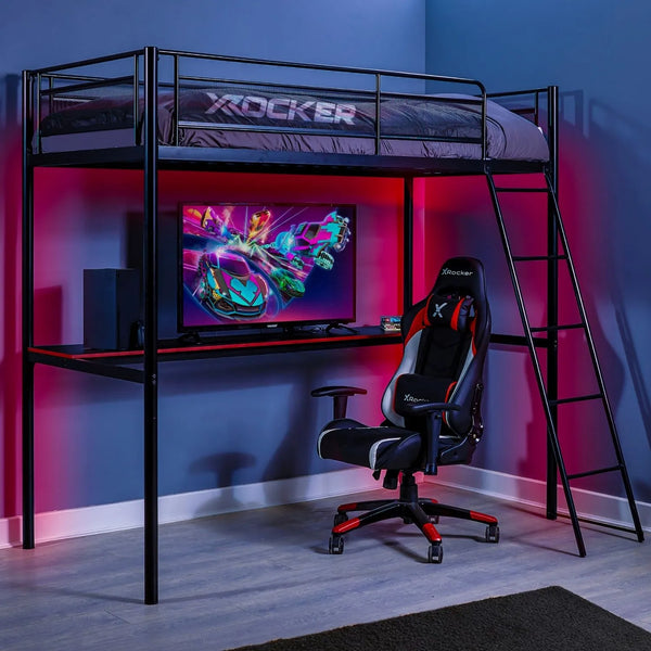 Gaming room setup with X rocker loft bed, desk, and chair in a dimly lit room.
